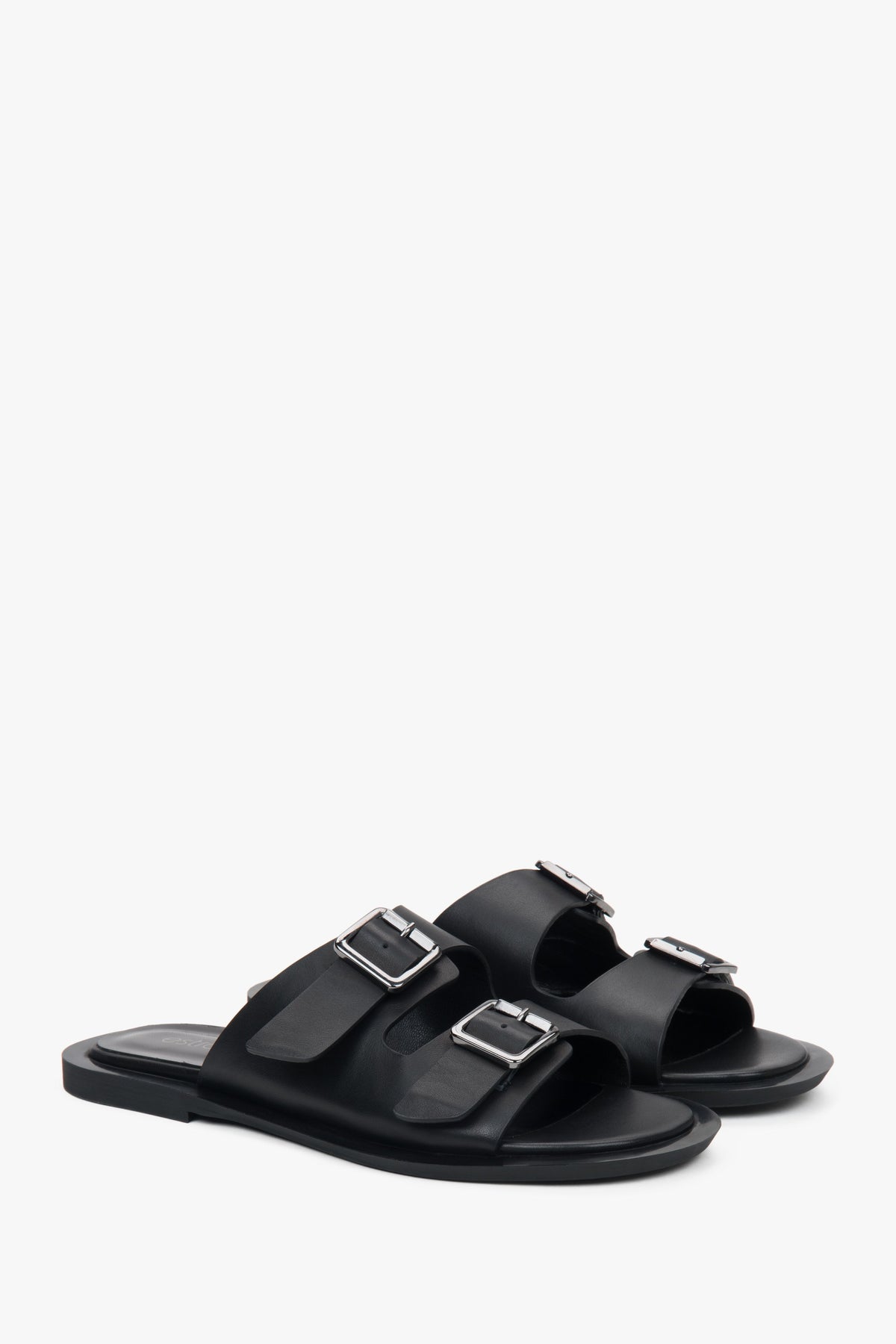 Minimalistische schwarze Damen-Leder-Slides von Estro mit zwei markanten Riemen.