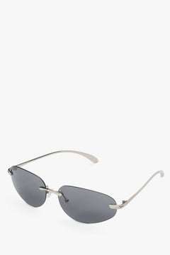 Schräge Ansicht der dunkelgrauen rahmenlosen Sonnenbrille mit Edelstahlbügeln.