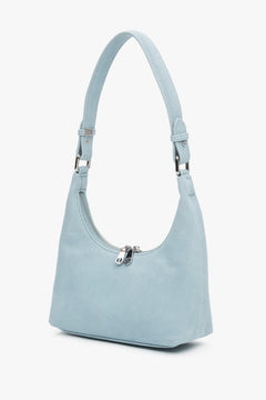 Seitenansicht der hellblauen Velours-Handtasche von Estro.