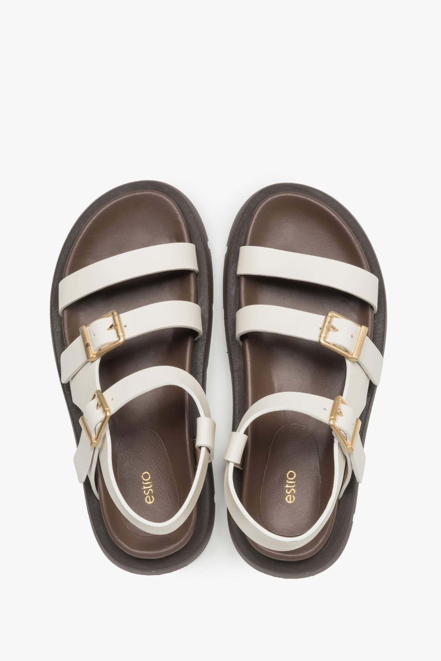 Milchbeige Damen-Sandalen aus Leder von oben als Paar mit dunkler Decksohle